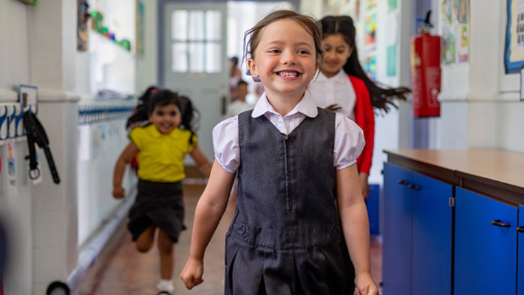 Kids running in school.